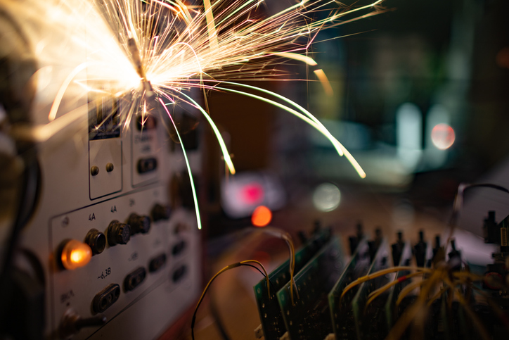 Electronic Sparks Scatter Quickly And Sharply From A Short Circuit On Technological Equipment In The Instrument Room
